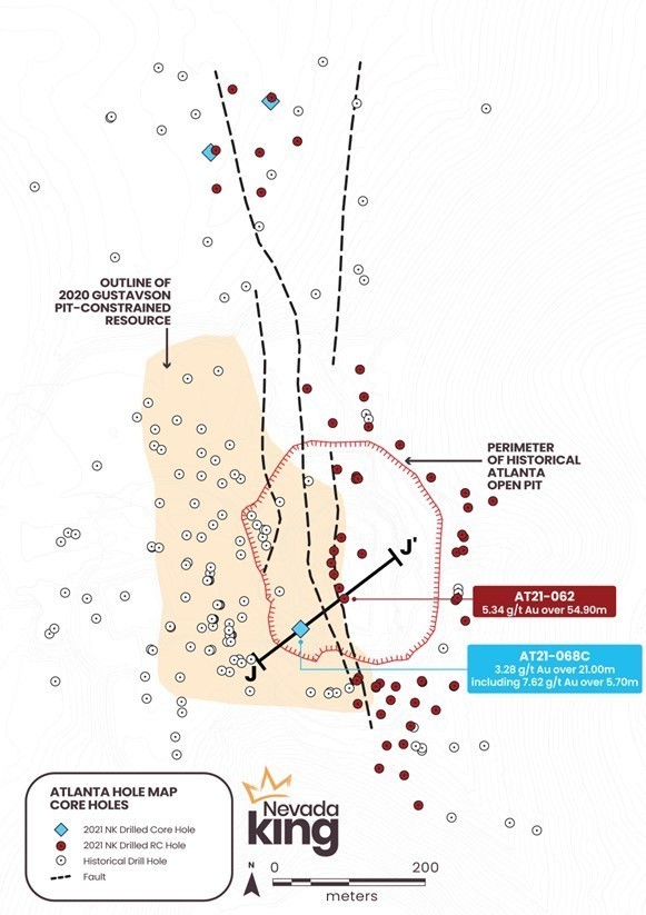Figure 1.  Location of 2021 core holes (blue diamonds) relative to 2021 RC holes (red dots) and historical holes (white dots). Black faults show surface trace of strands comprising the Atlanta Mine Fault zone. (CNW Group/Nevada King Gold Corp.)